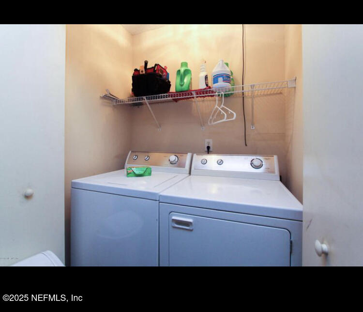 1000 Fleming Street Fleming Island, FL 32003 - Photo 12 of 17 a bathroom with a sink and a picture on the wall