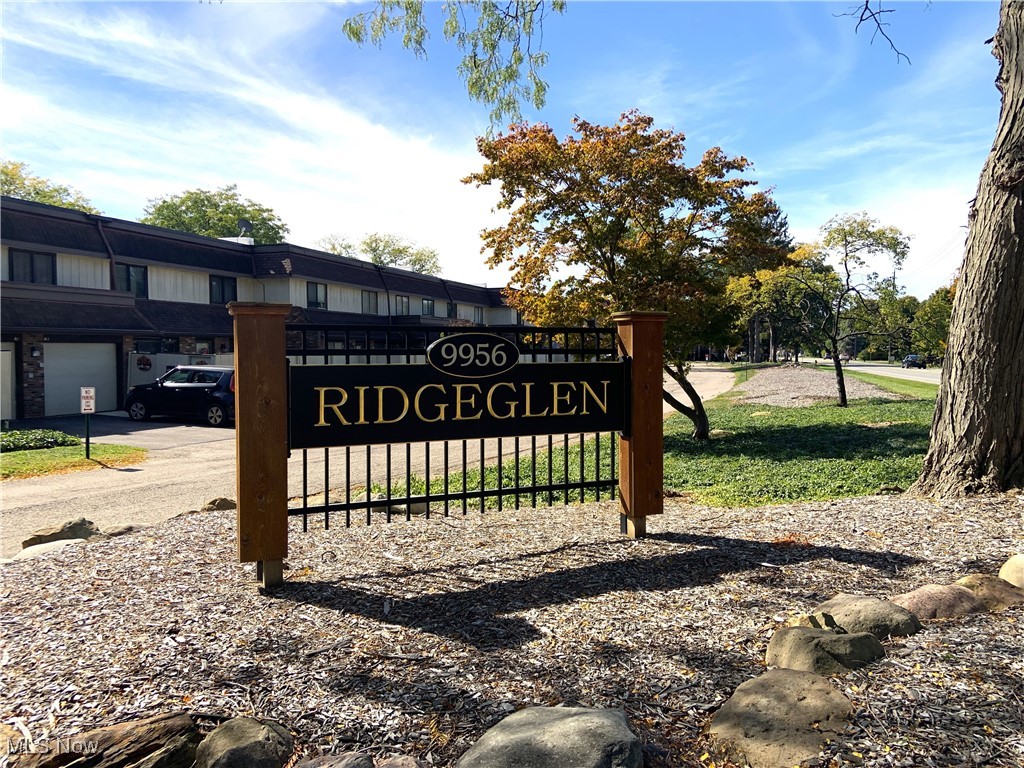 9956 Johnnycake Ridge Road, Unit D9 Painesville, OH 44077 - Photo 37 of 37 Community sign featuring a yard