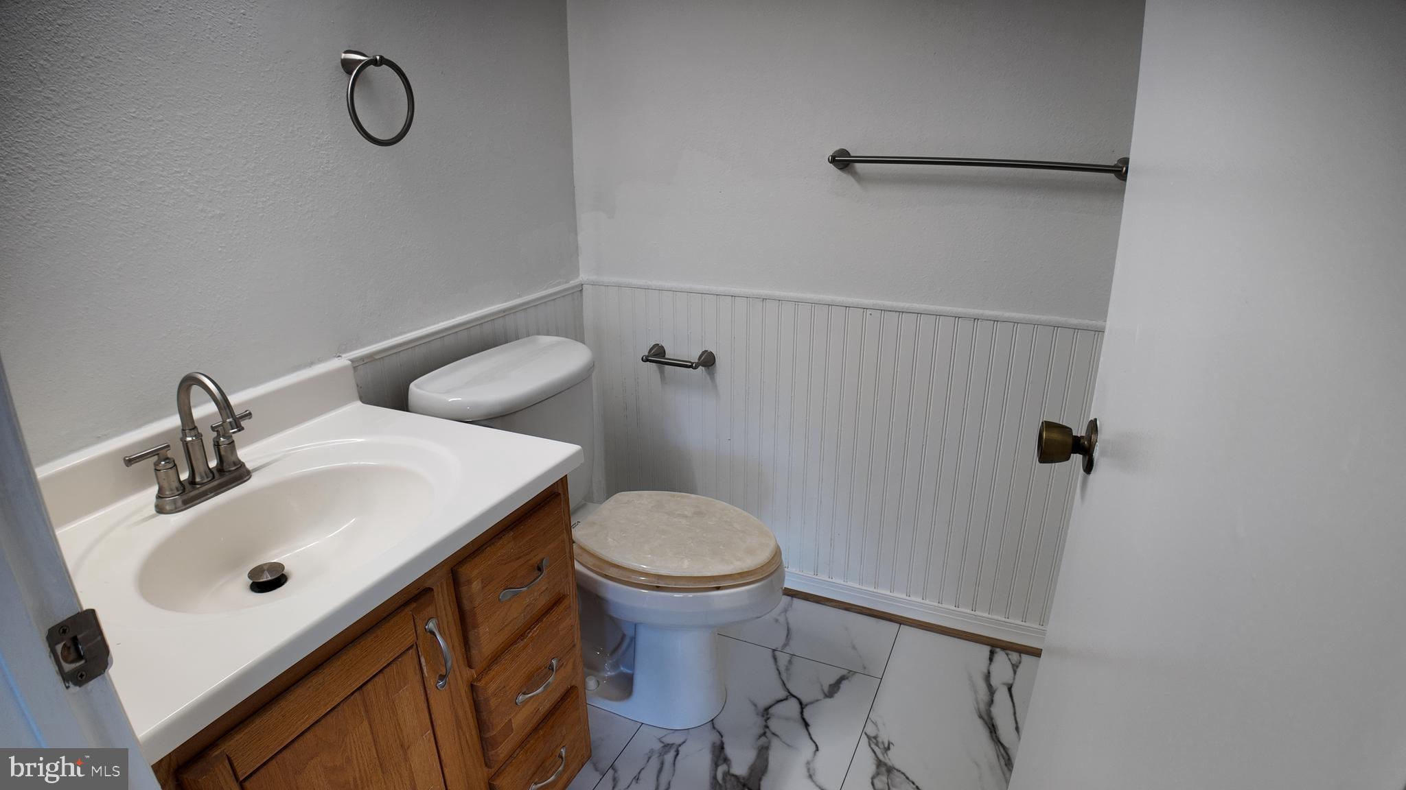 15311 Beaverbrook Court, Unit 903B Silver Spring, MD 20906 - Photo 30 of 36 a bathroom with a sink toilet and shower