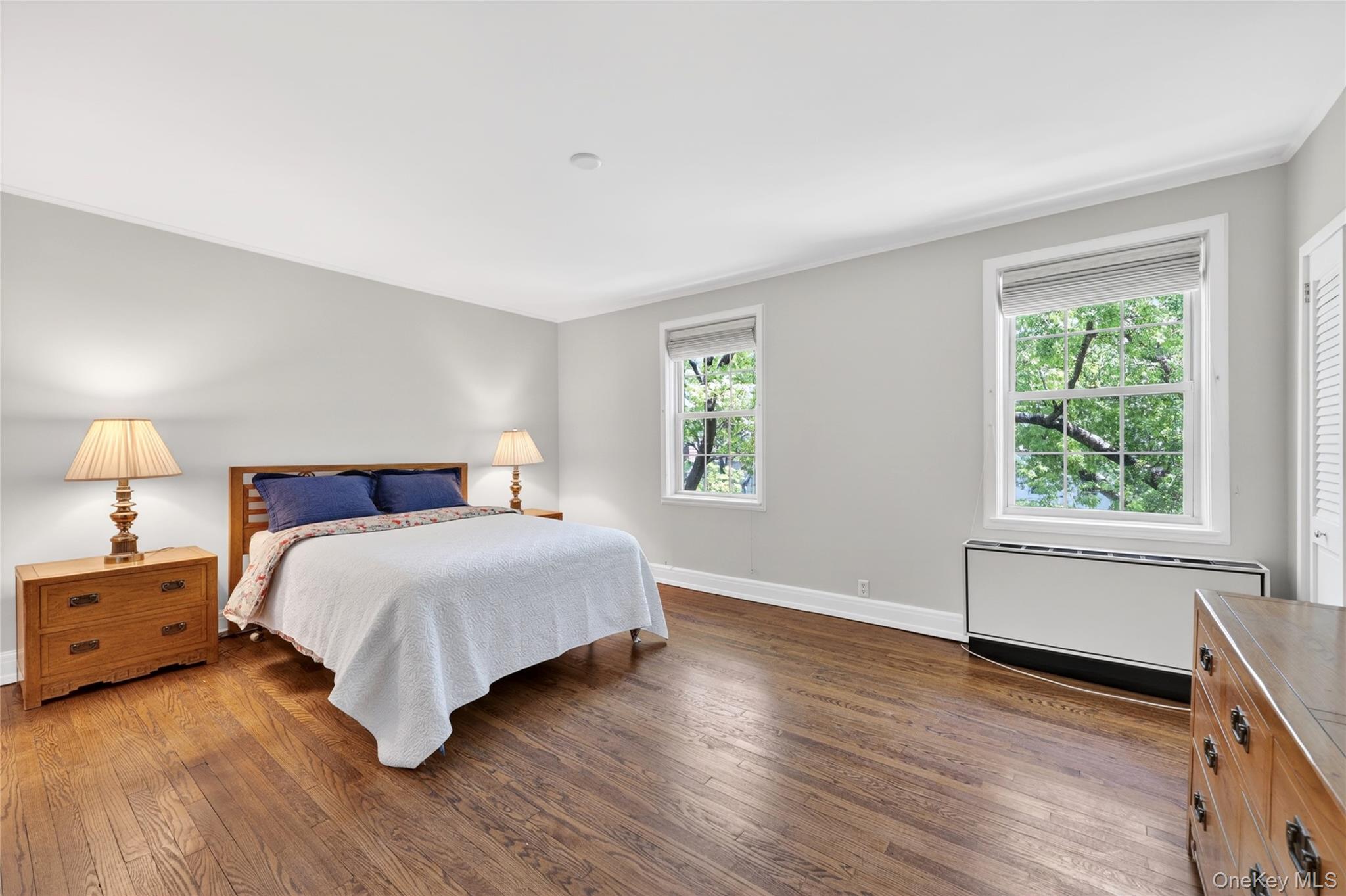 10 Brooklands, Unit 5H Bronxville, NY 10708 - Photo 19 of 33 Spacious Primary Bedroom facing East with Beautiful Hardwood Floors, and Full bathroom