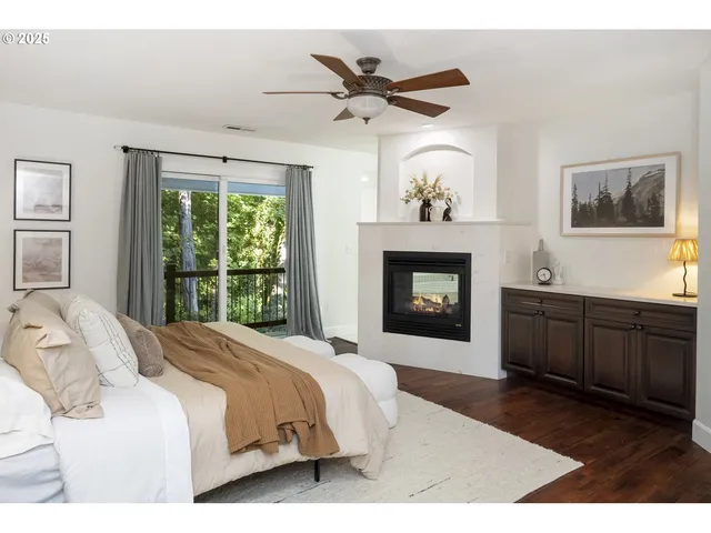 a bedroom with a bed and a fireplace