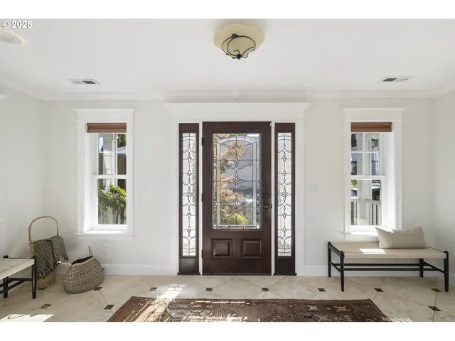 a living room with furniture and windows