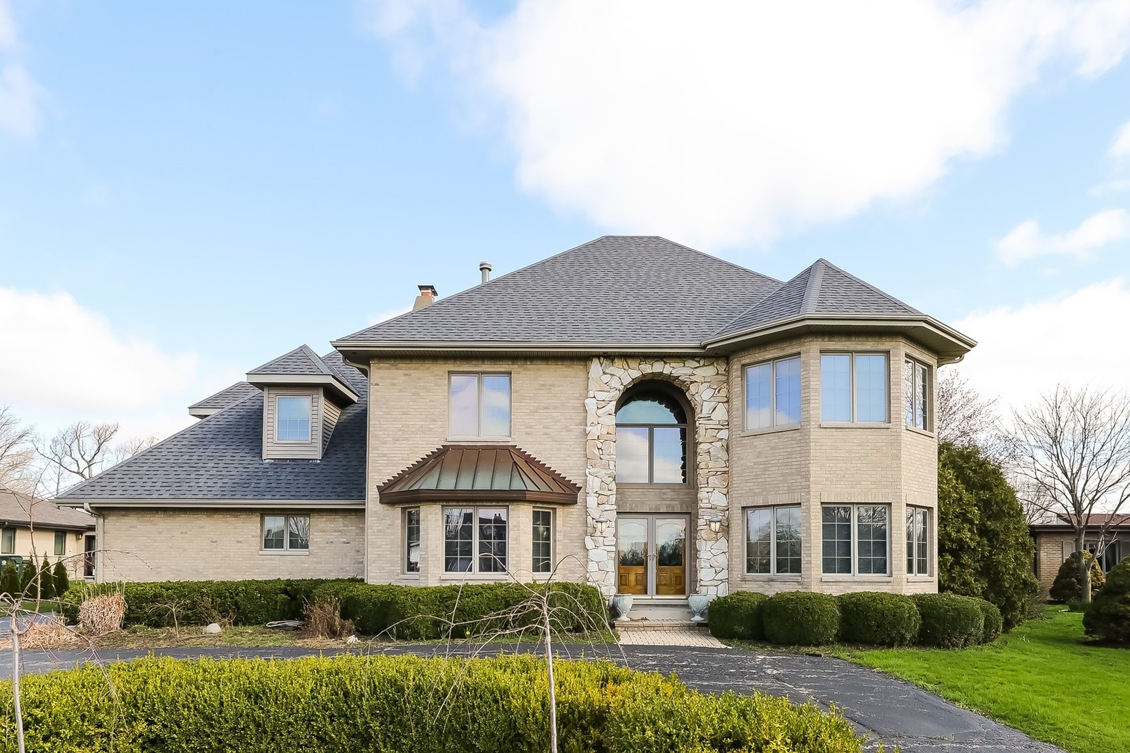 a front view of a house with a yard