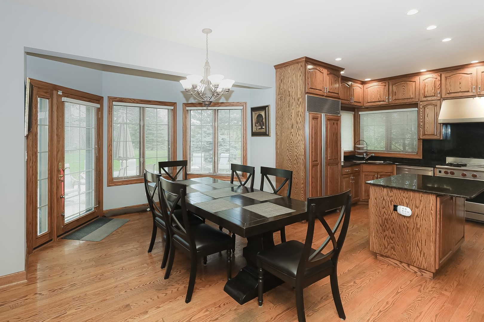 307 79th Street Burr Ridge, IL 60527 - Photo 15 of 41 a view of a dining room with furniture wooden floor and chandelier