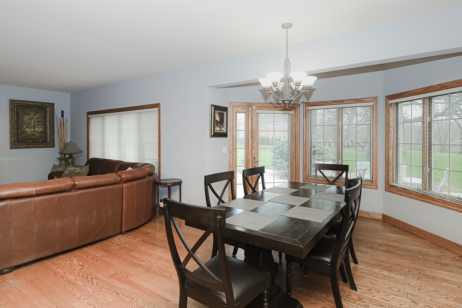 307 79th Street Burr Ridge, IL 60527 - Photo 16 of 41 a view of a dining room with furniture window and wooden floor