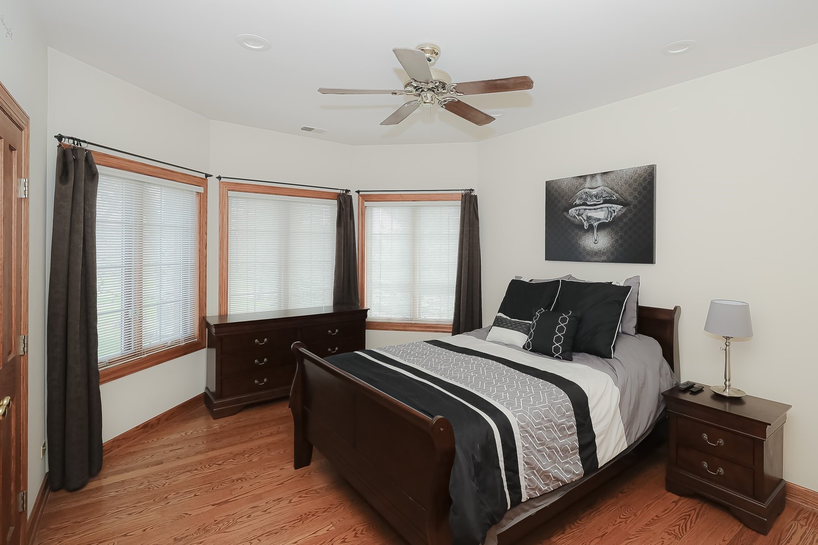 307 79th Street Burr Ridge, IL 60527 - Photo 24 of 41 a bedroom with a bed and a window