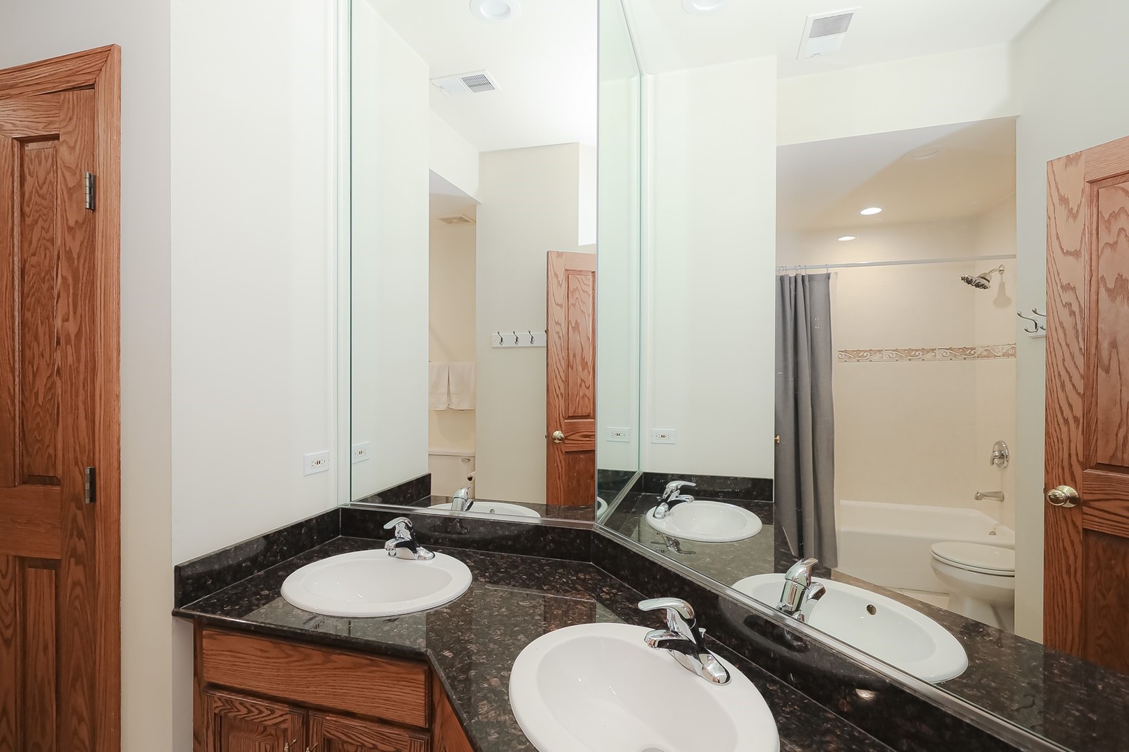 307 79th Street Burr Ridge, IL 60527 - Photo 26 of 41 a bathroom with a granite countertop sink toilet a mirror and shower