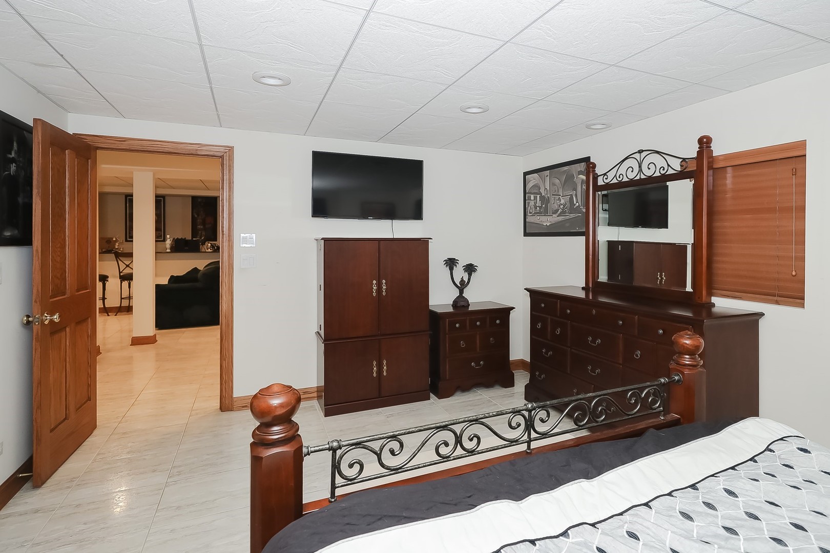 307 79th Street Burr Ridge, IL 60527 - Photo 35 of 41 a living room with a wooden floor and a flat screen tv