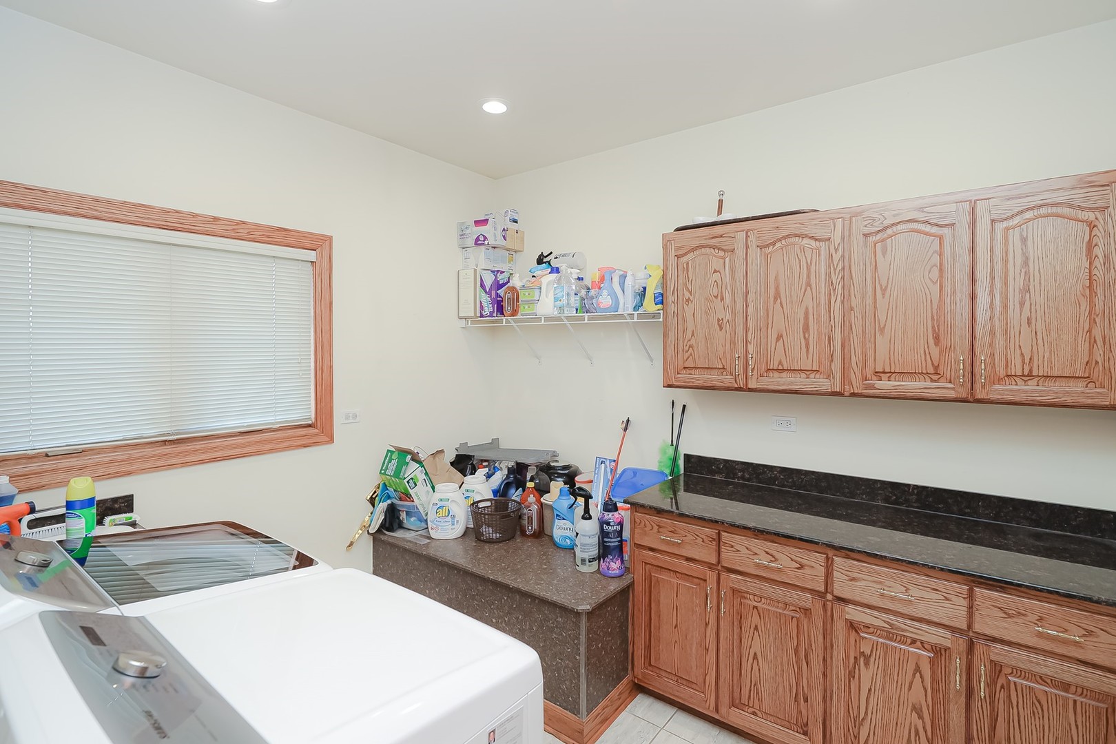 307 79th Street Burr Ridge, IL 60527 - Photo 36 of 41 a kitchen with granite countertop a sink cabinets and window