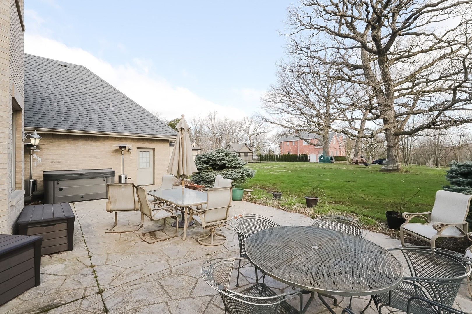 307 79th Street Burr Ridge, IL 60527 - Photo 37 of 41 a view of a patio with table and chairs and potted plants