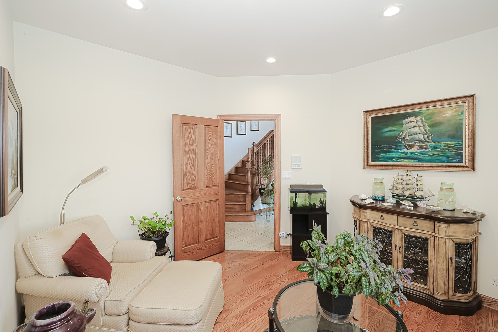 307 79th Street Burr Ridge, IL 60527 - Photo 9 of 41 a living room with furniture potted plant and a fireplace