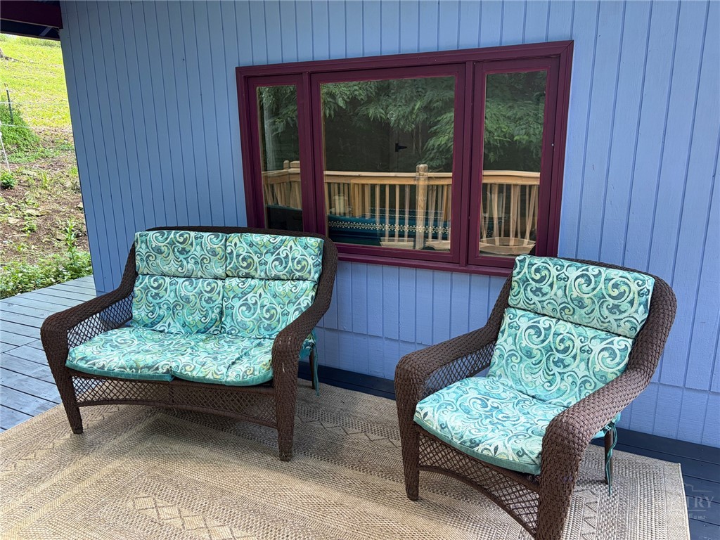 873 Silverleaf Road Zionville, NC 28698 - Photo 7 of 49 a view of a two chairs in the patio