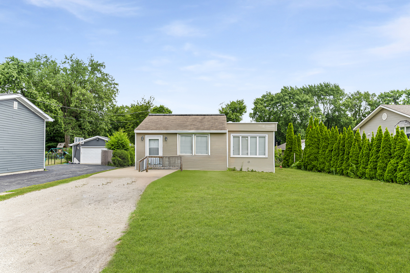 1S217 Valley Road Lombard, IL 60148 - Photo 1 of 25 a front view of a house with a yard and trees