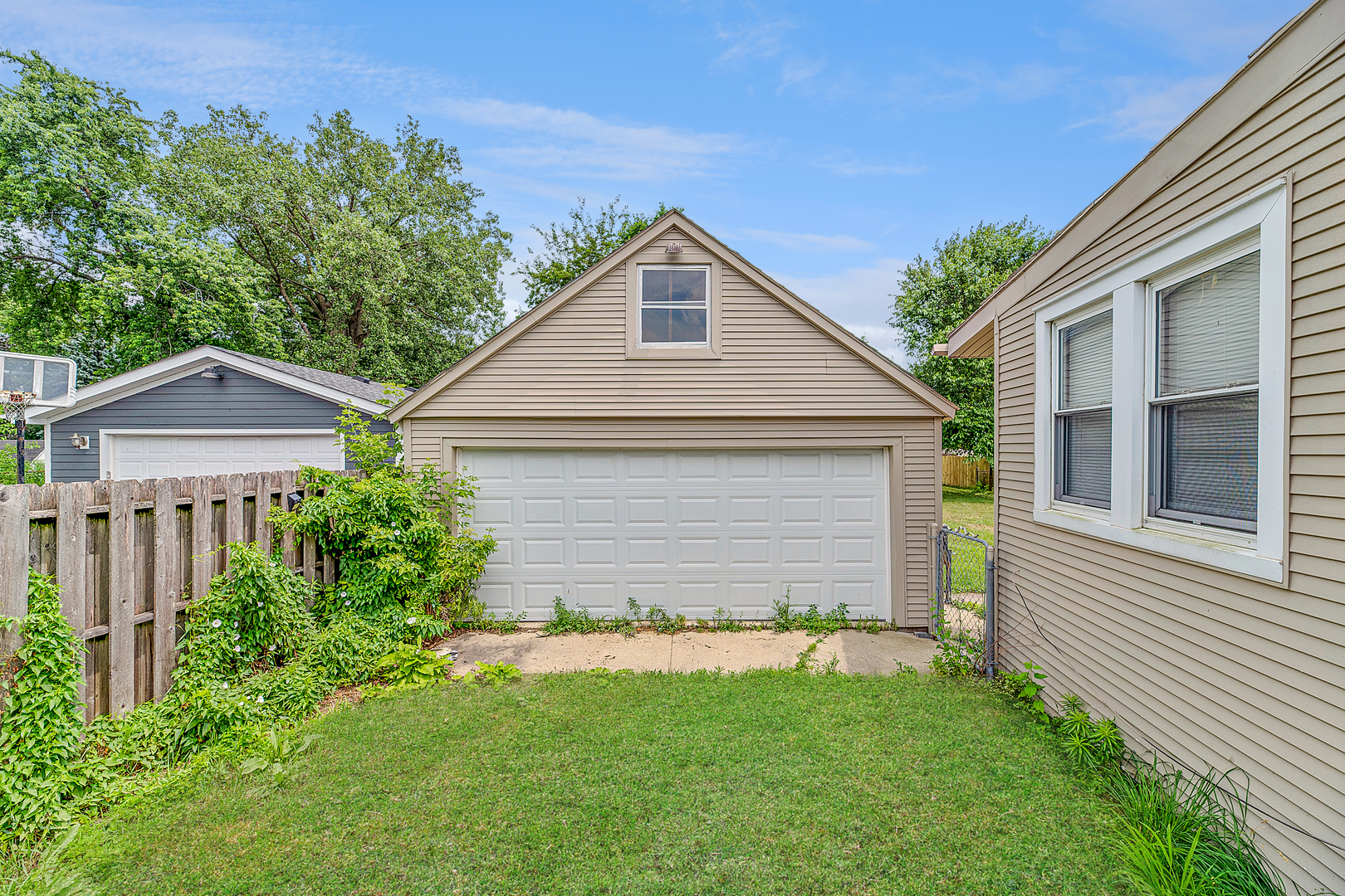 1S217 Valley Road Lombard, IL 60148 - Photo 20 of 25 a front view of a house with a yard and garage