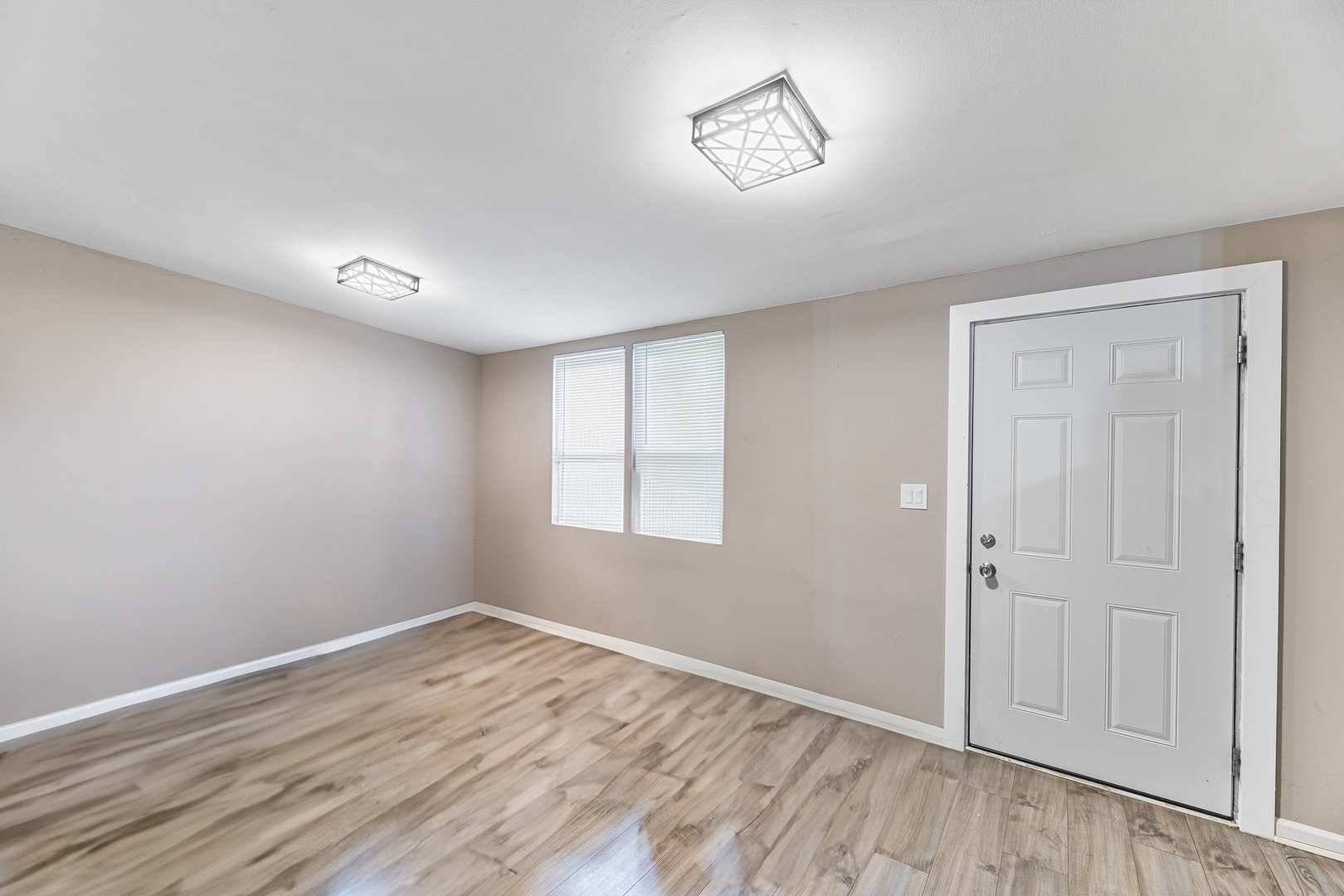 1S217 Valley Road Lombard, IL 60148 - Photo 2 of 25 a view of empty room with wooden floor and fan