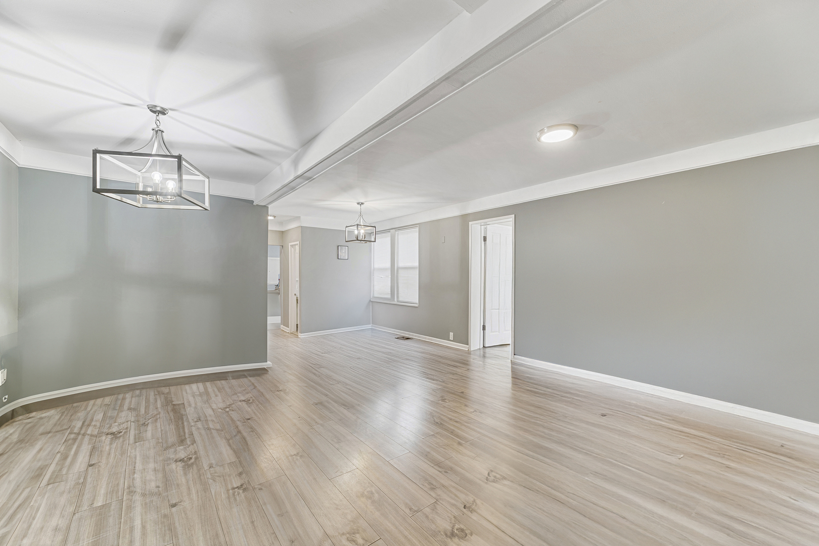 1S217 Valley Road Lombard, IL 60148 - Photo 3 of 25 a view of an empty room with wooden floor