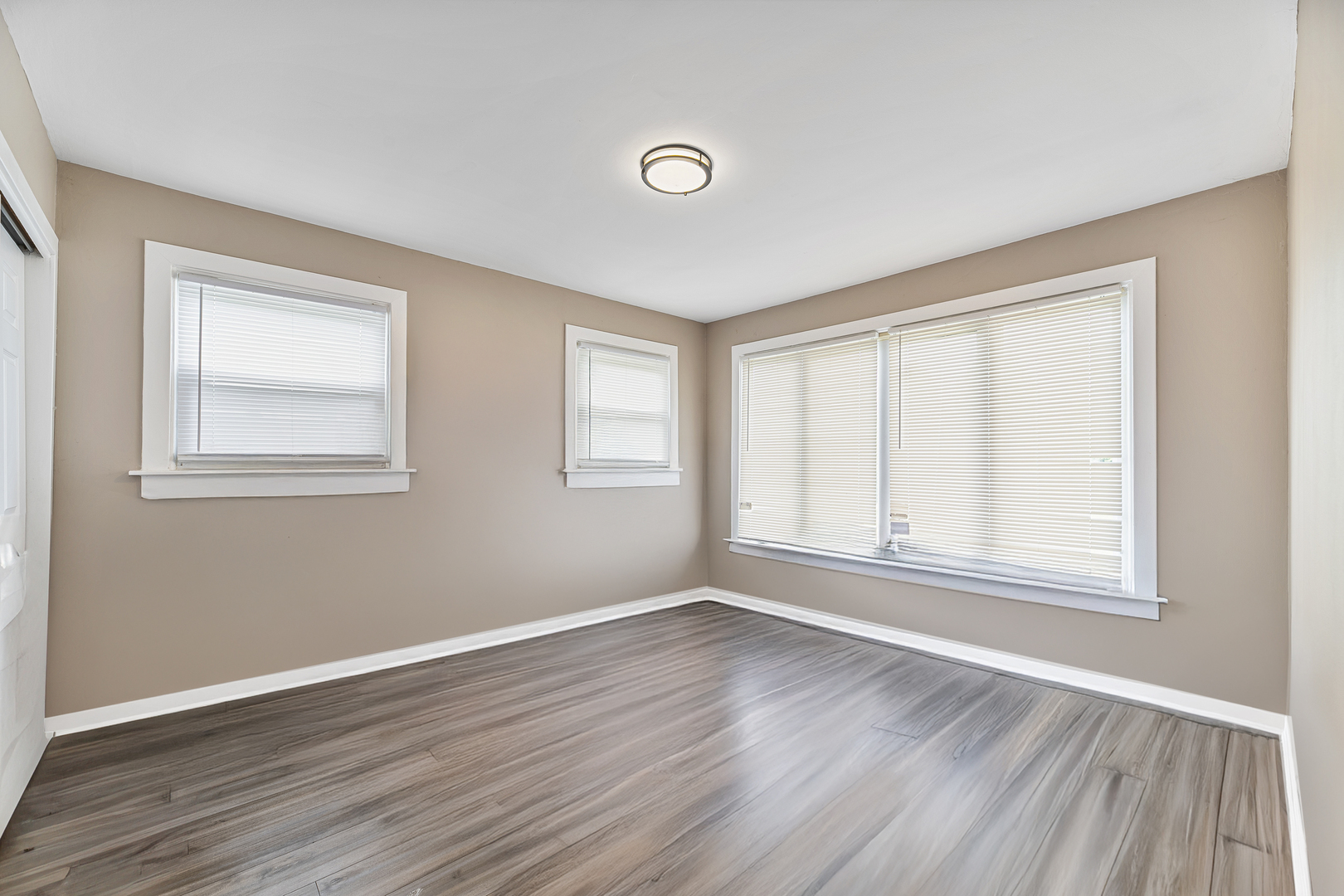 1S217 Valley Road Lombard, IL 60148 - Photo 8 of 25 a view of empty room with wooden floor and fan
