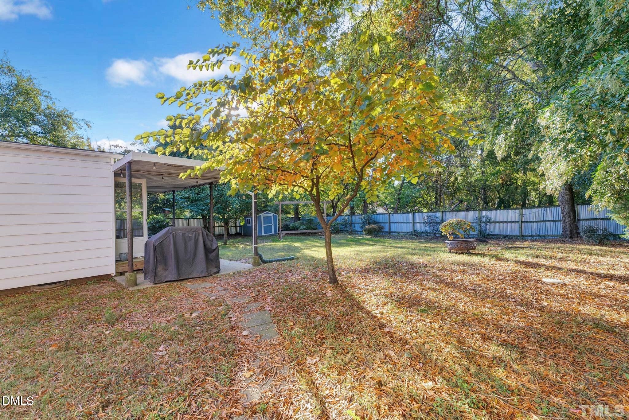 2106 Tudor Place Raleigh, NC 27610 - Photo 11 of 11 a view of a backyard with a small cabin