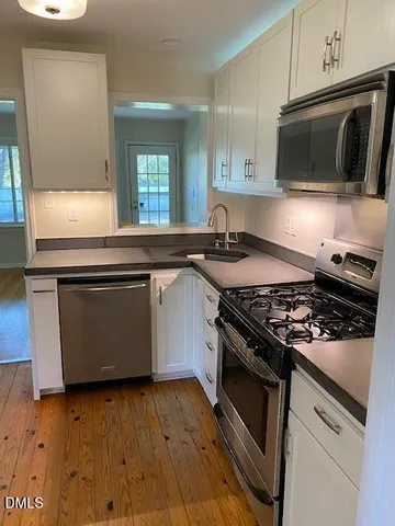 a kitchen with a stove and a microwave