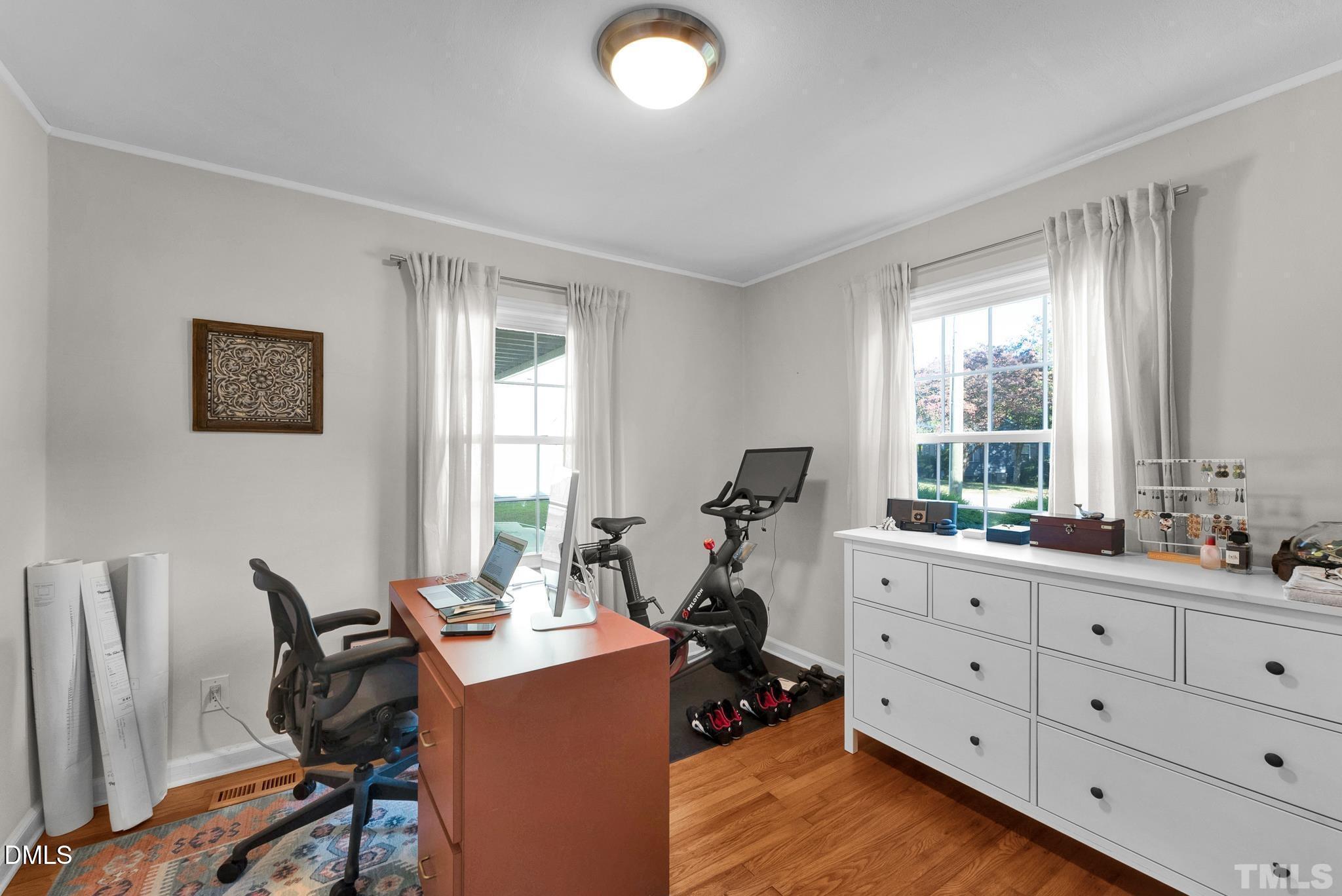 2106 Tudor Place Raleigh, NC 27610 - Photo 9 of 11 a view of a workspace with furniture and a window