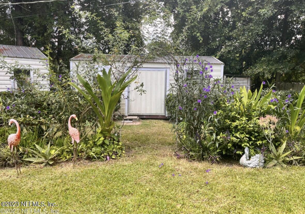 96089 Maranatha Road Yulee, FL 32097 - Photo 11 of 18 a view of a yard with plants and trees