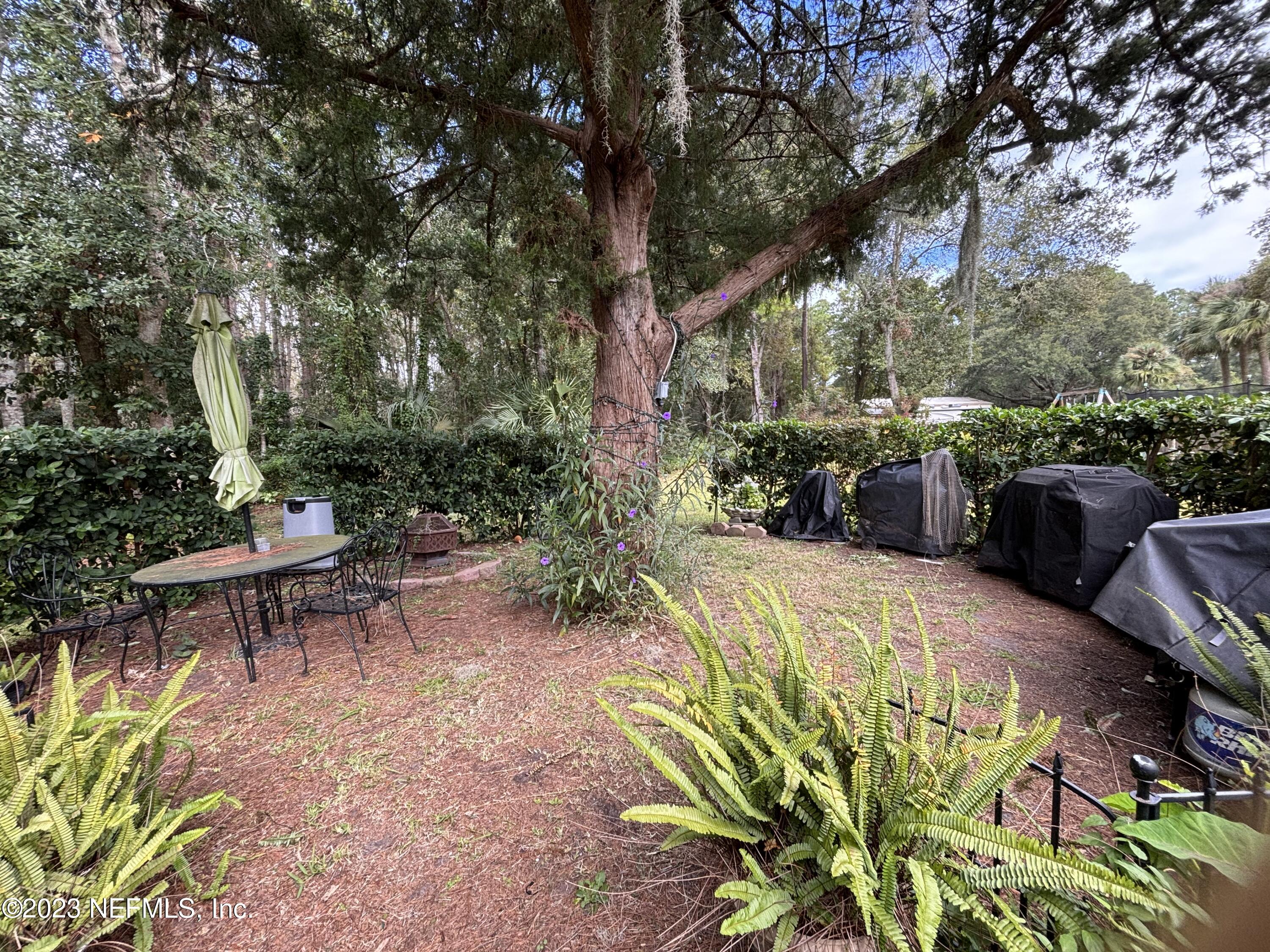 96089 Maranatha Road Yulee, FL 32097 - Photo 18 of 18 a view of outdoor sitting area with furniture