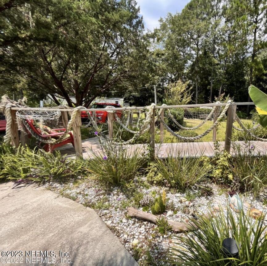 96089 Maranatha Road Yulee, FL 32097 - Photo 8 of 18 a garden view with a sitting space