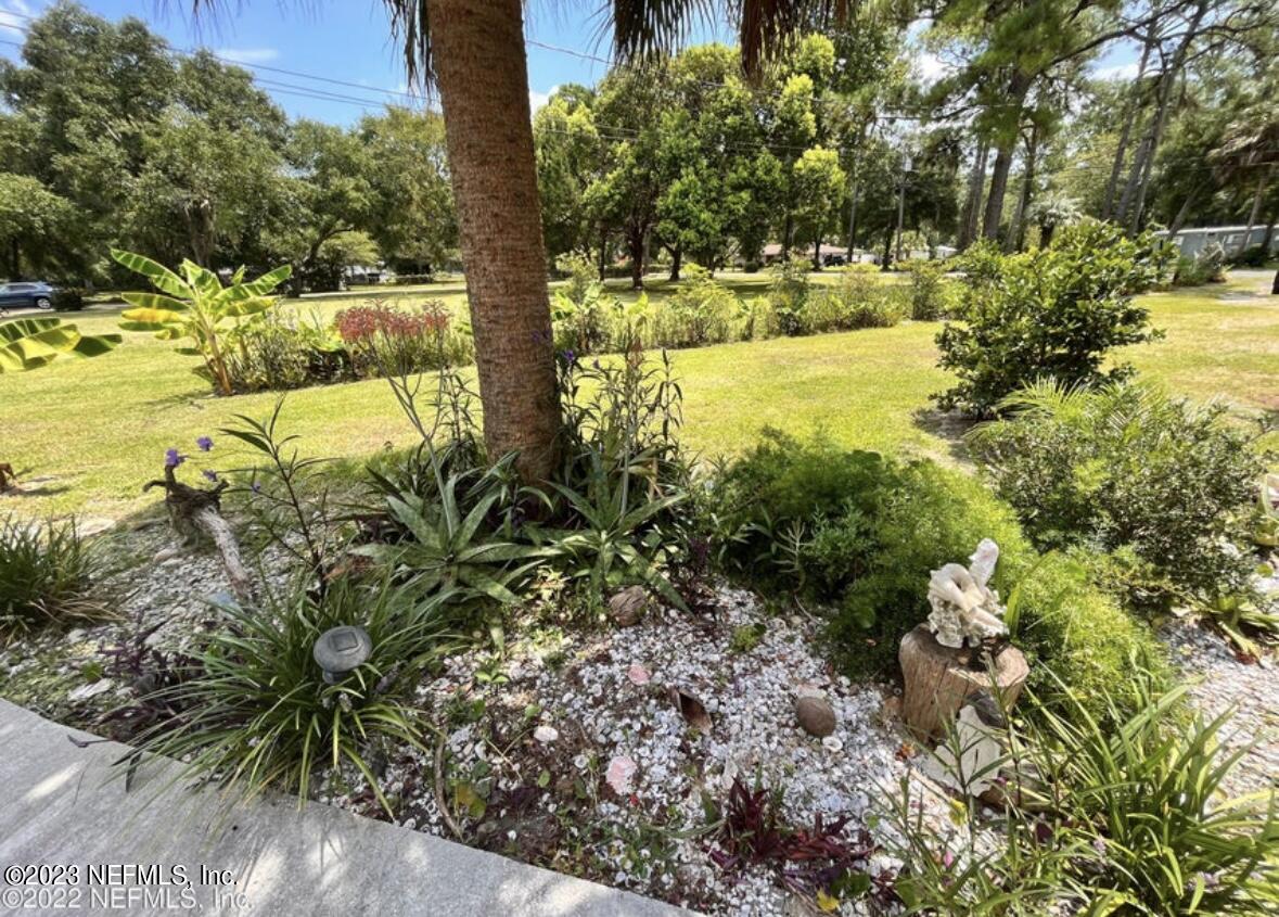 96089 Maranatha Road Yulee, FL 32097 - Photo 9 of 18 a view of a yard with plants