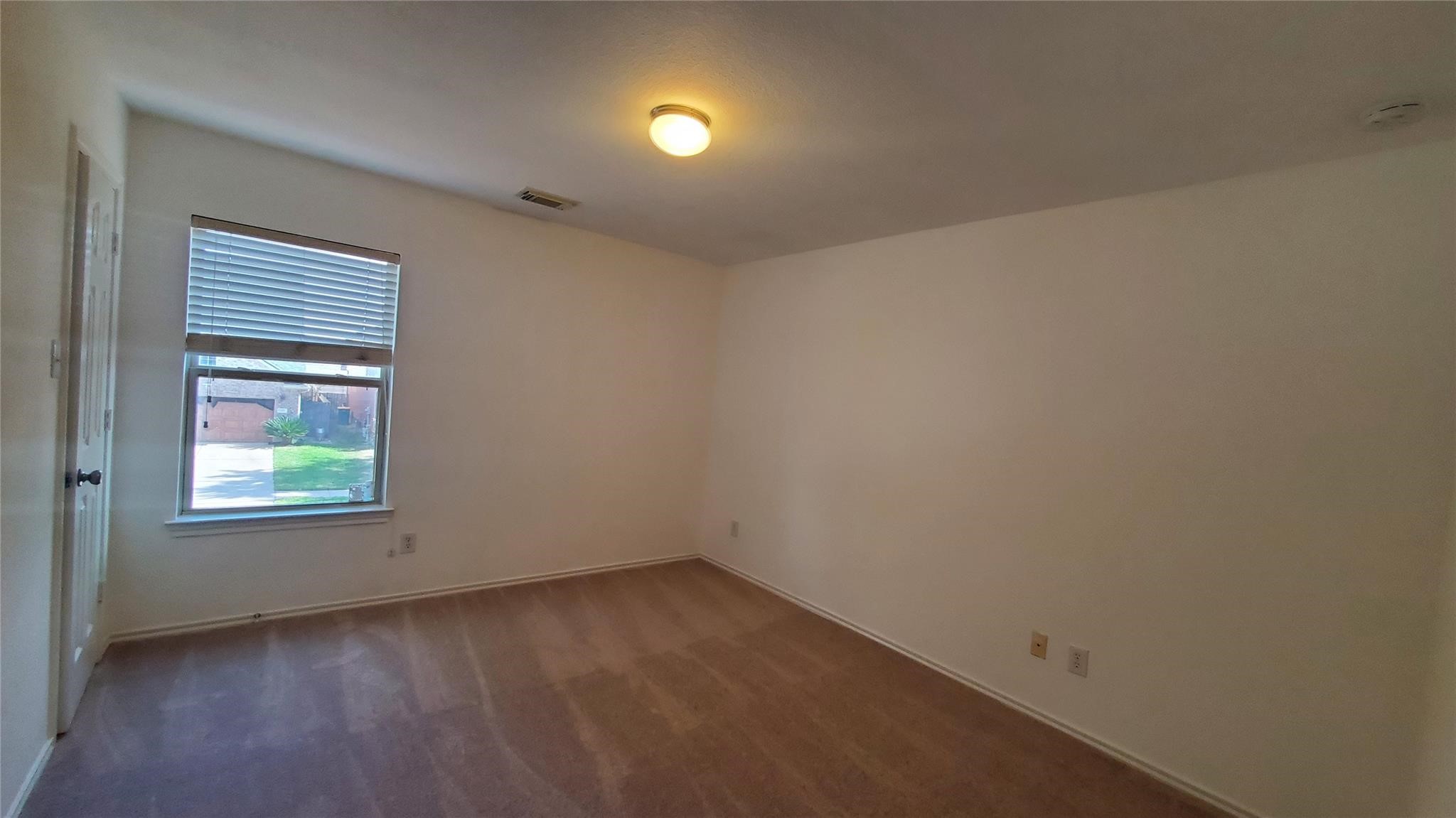 2814 Silver Point Lane Rosharon, TX 77583 - Photo 11 of 29 an empty room with a window