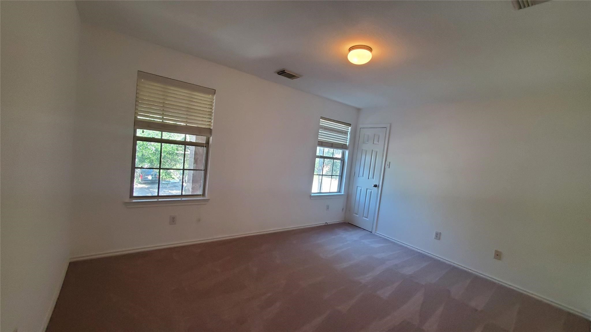 2814 Silver Point Lane Rosharon, TX 77583 - Photo 12 of 29 an empty room with windows and closet