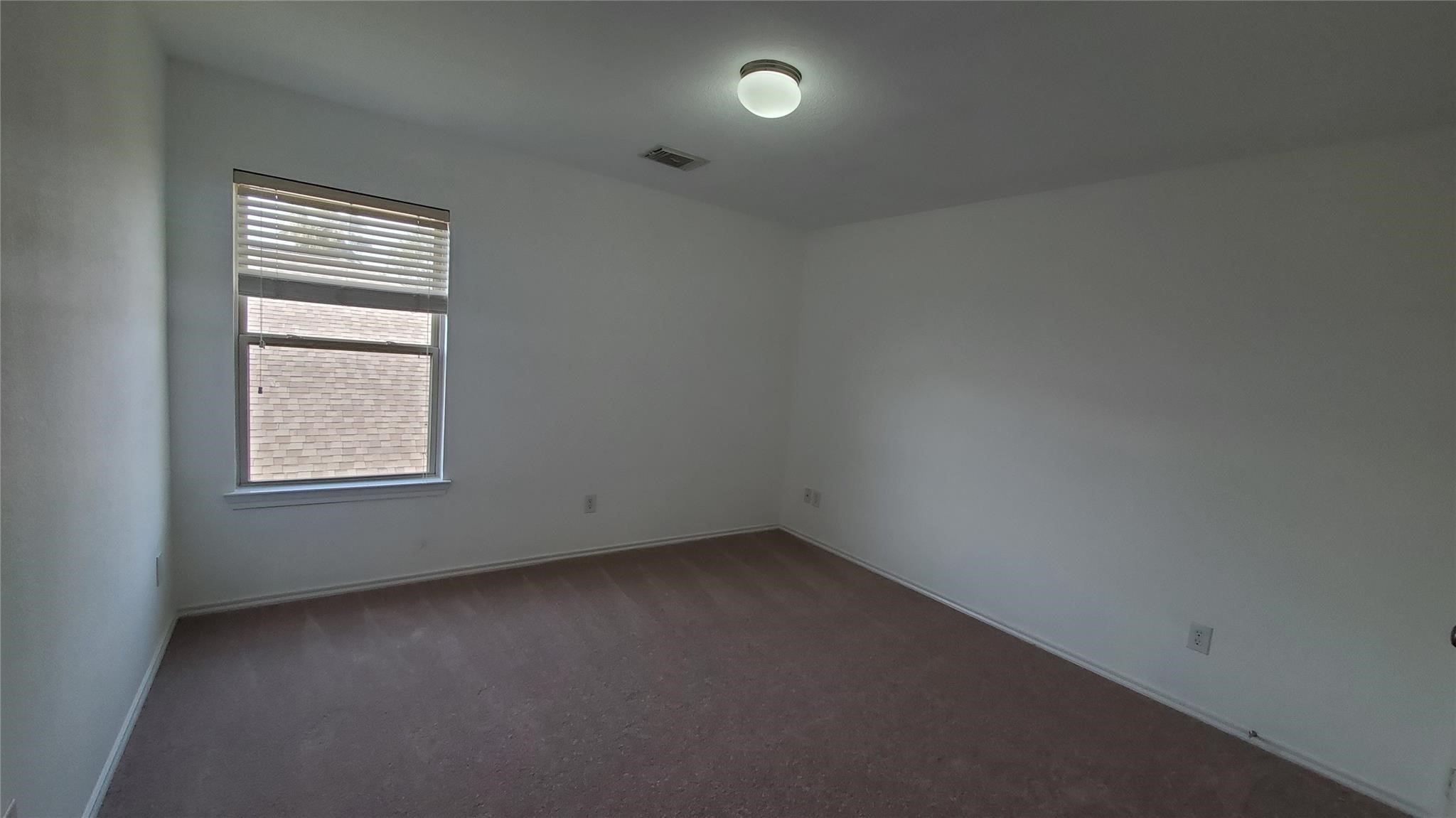 2814 Silver Point Lane Rosharon, TX 77583 - Photo 15 of 29 an empty room with a window