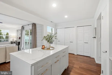a room with sink cabinets and wooden floor