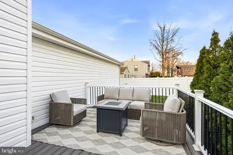 a view of a balcony with furniture