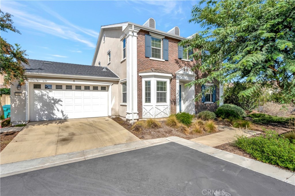 113 Spica Irvine, CA 92618 - Photo 1 of 1 a front view of a house with a yard and garage