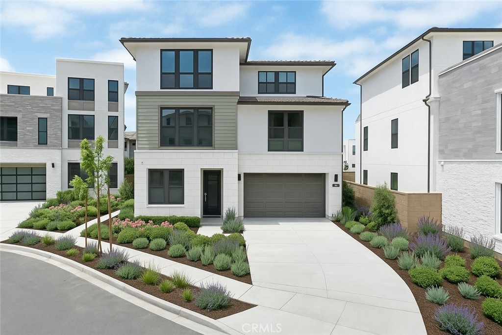 217 Stage Irvine, CA 92618 - Photo 1 of 26 a front view of a house with a garden