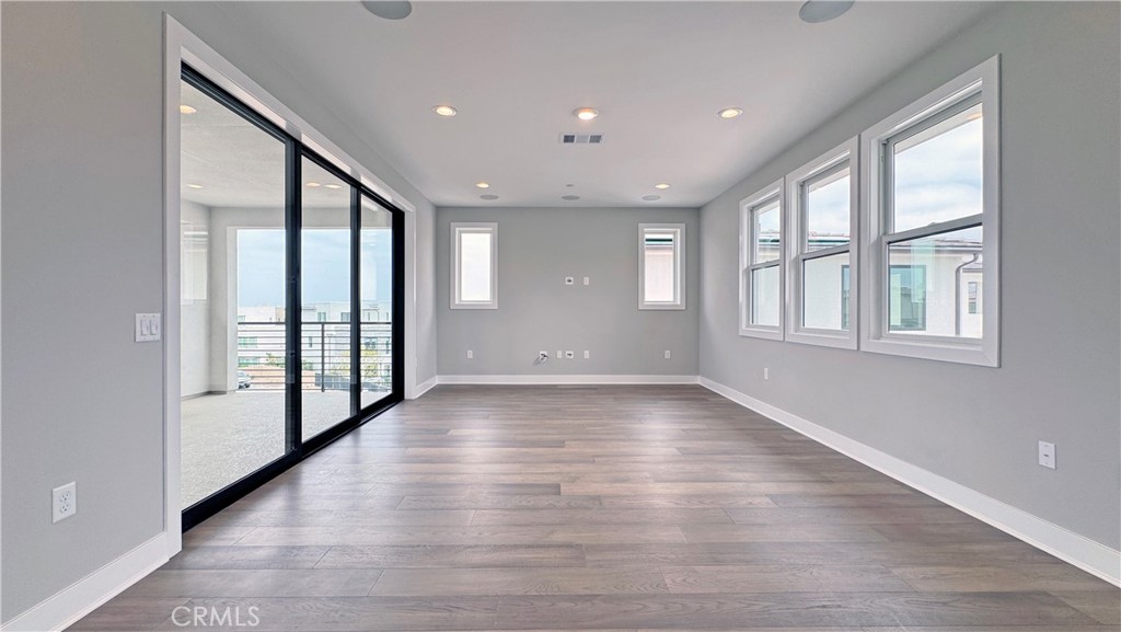 217 Stage Irvine, CA 92618 - Photo 19 of 26 a view of an entryway with wooden floor and windows