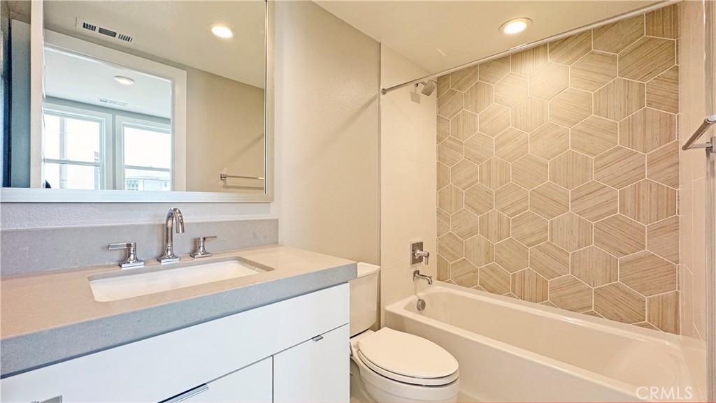 217 Stage Irvine, CA 92618 - Photo 23 of 26 a bathroom with a sink a toilet and shower