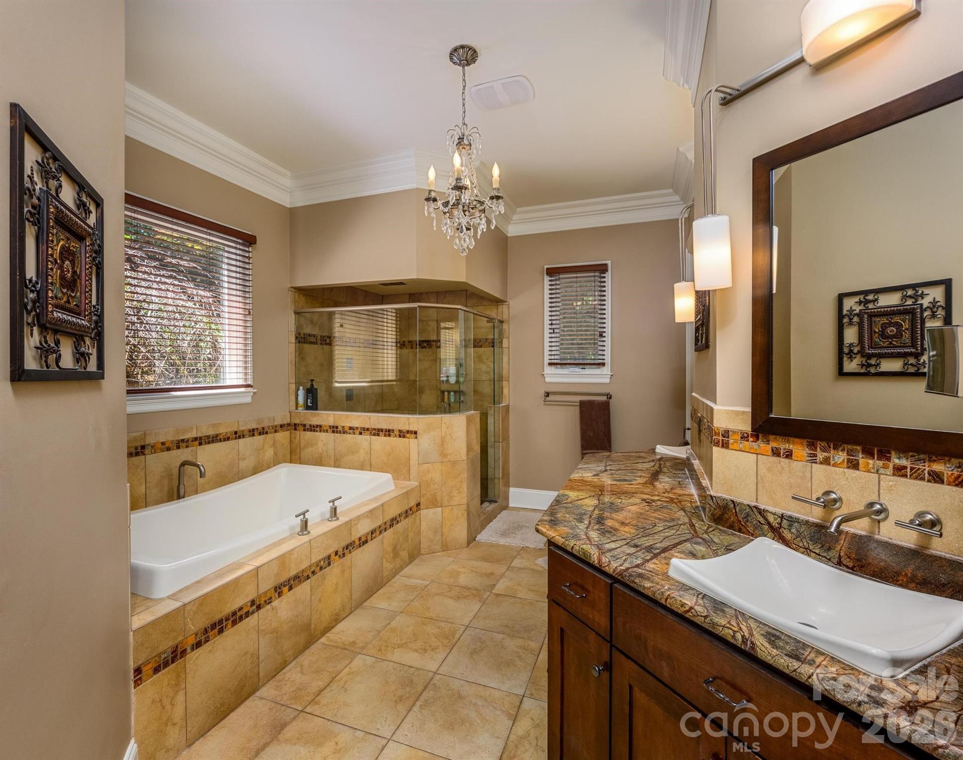7315 Bay Ridge Drive Denver, NC 28037 - Photo 16 of 39 a spacious bathroom with a granite countertop tub sink and mirror