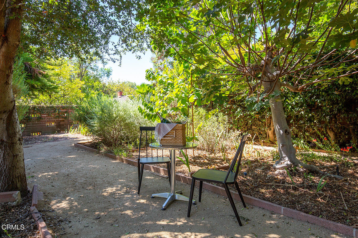 3880 Hampton Road Pasadena, CA 91107 - Photo 24 of 32 a view of a backyard with table and chairs and a tree