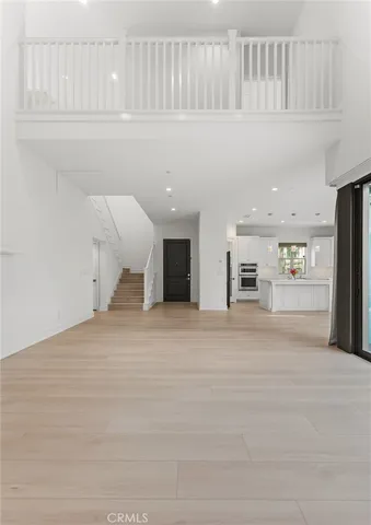 a view of kitchen and livingroom with furniture