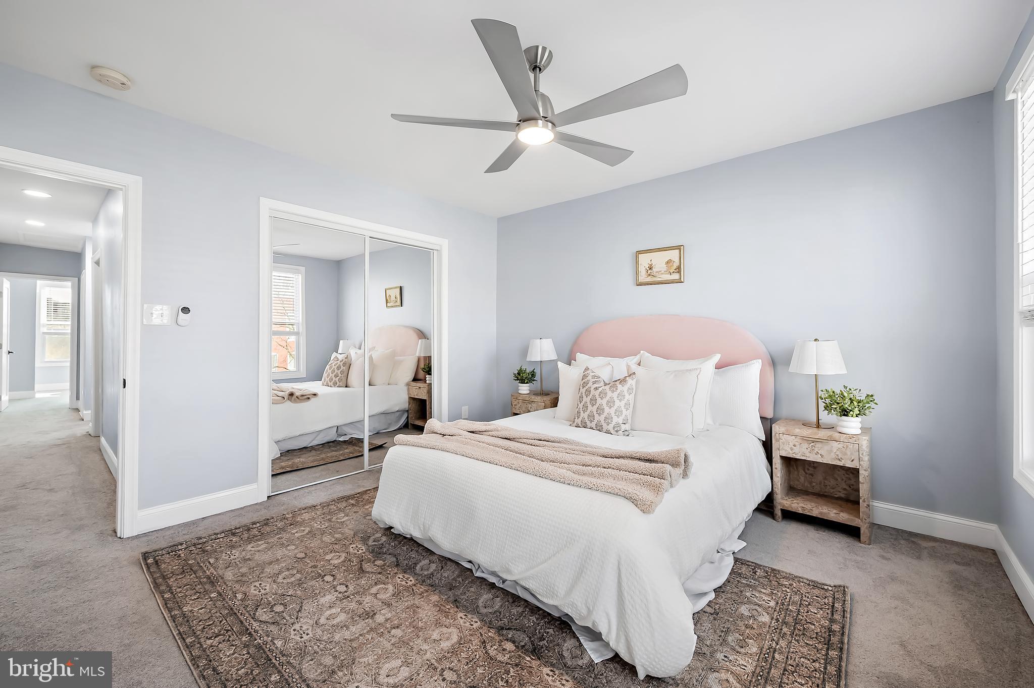 3137 Keswick Road Baltimore, MD 21211 - Photo 14 of 31 a bedroom with a bed and a chandelier