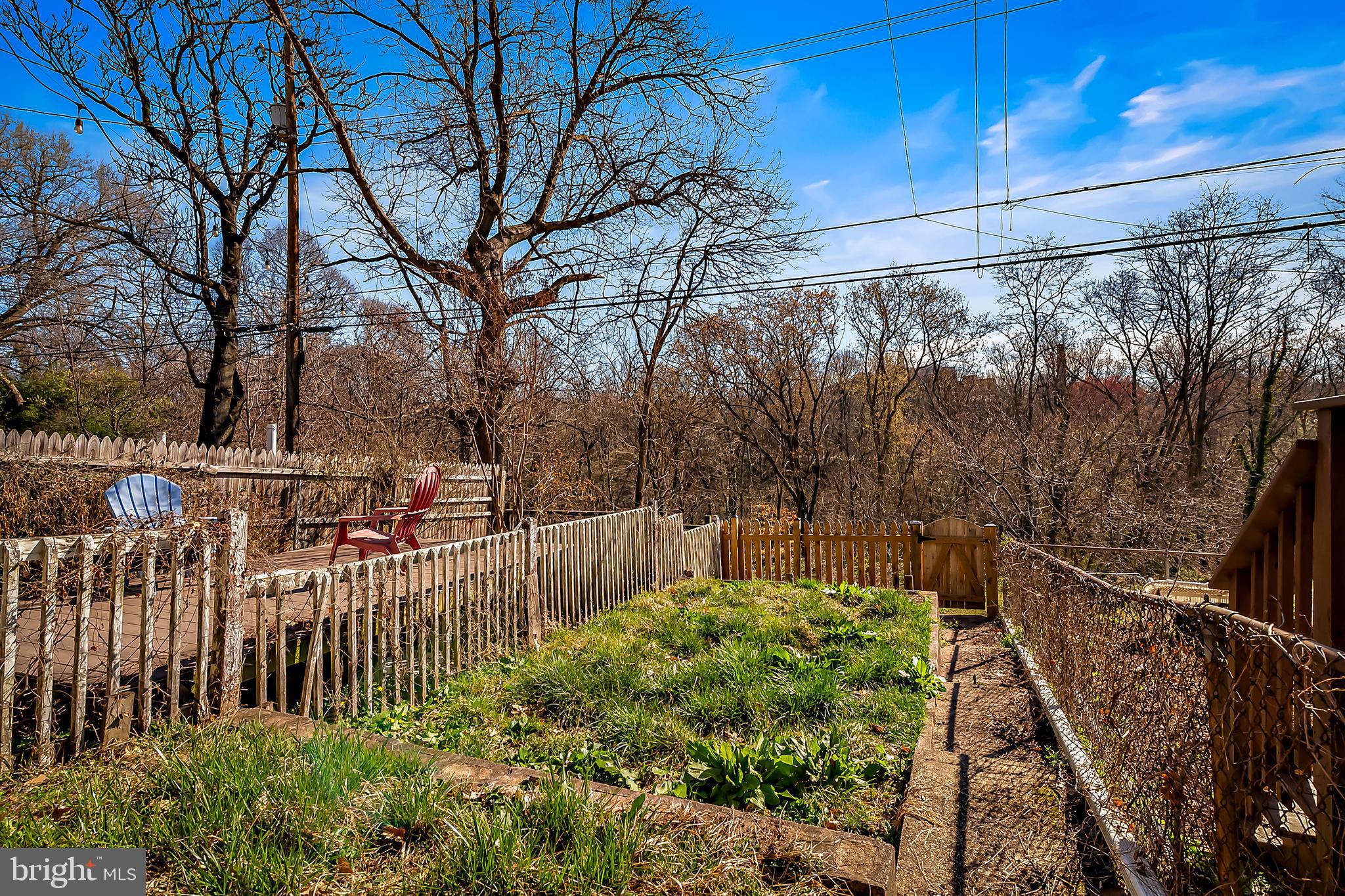 3137 Keswick Road Baltimore, MD 21211 - Photo 26 of 31 a view of a pathway with a wrought fence