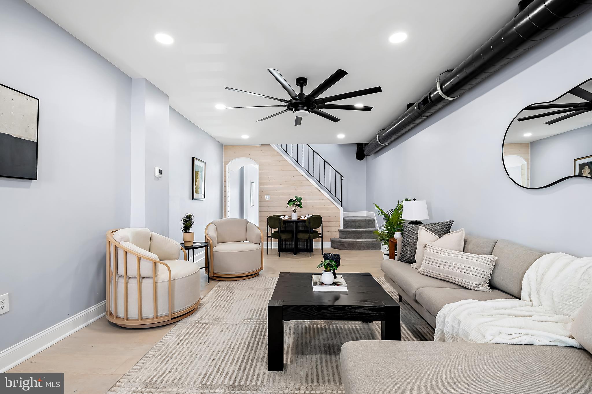 3137 Keswick Road Baltimore, MD 21211 - Photo 3 of 31 a living room with furniture a ceiling fan and a rug
