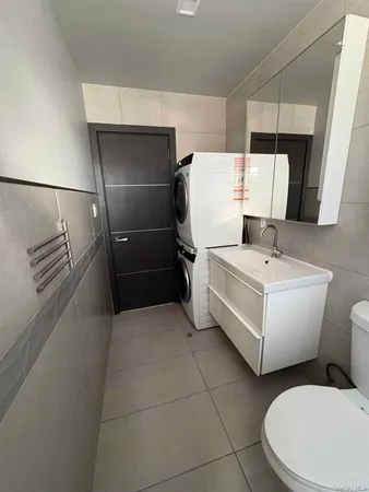 a white bath tub sitting in a bathroom