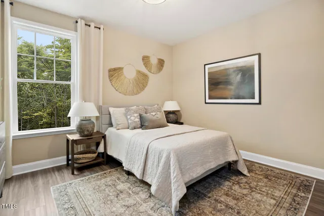 a bedroom with bed and a window