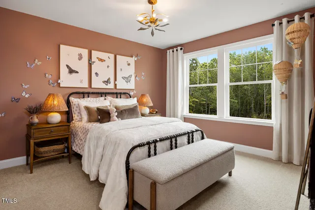 a large kitchen with kitchen island a stove a sink a center island and wooden floor