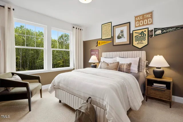 a living room with hard wood floors and a kitchen