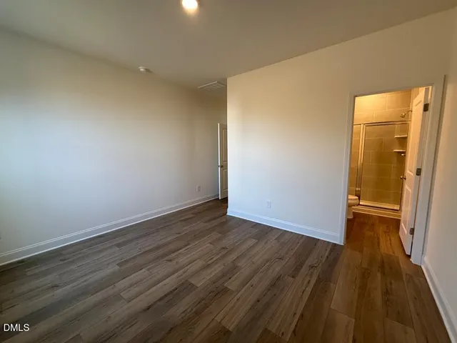 a bathroom with a shower and a sink
