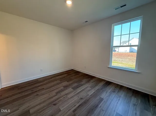 a room with a sink and a mirror