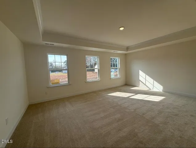 a view of an empty room and a window